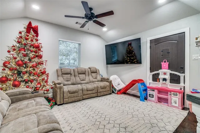 a living room with furniture a couch and a window