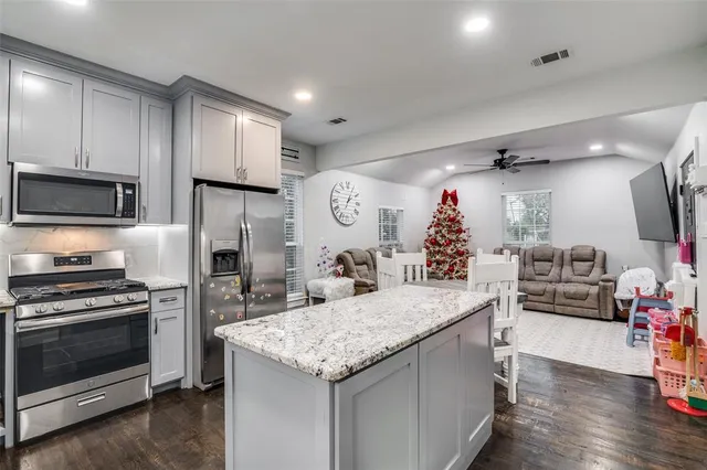 a front view of house with yard and trees