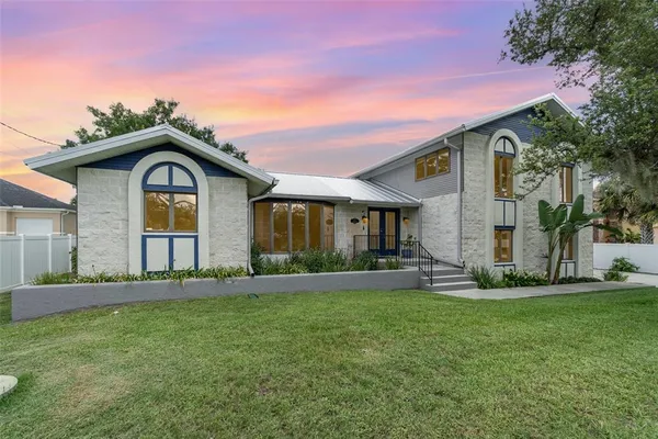 a front view of a house with garden