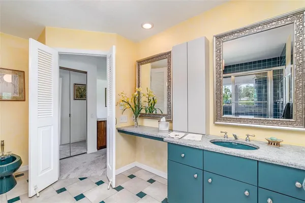 a living room with furniture a window and a chandelier