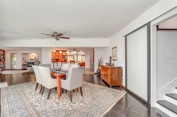 a large kitchen with lots of counter space and dining table