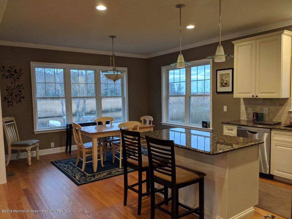 611 Riverside Drive Bayville, NJ 08721 - Photo 11 of 22 a dining room with furniture and wooden floor