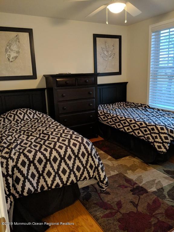 611 Riverside Drive Bayville, NJ 08721 - Photo 15 of 22 a bedroom with a bed and window