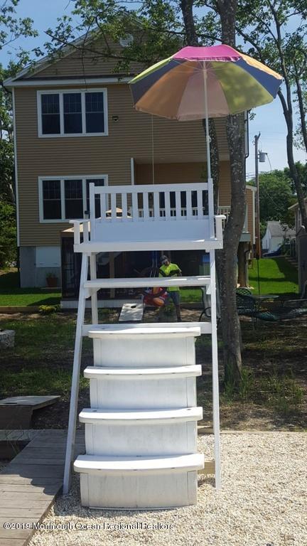 611 Riverside Drive Bayville, NJ 08721 - Photo 8 of 22 a front view of a house with yard and porch