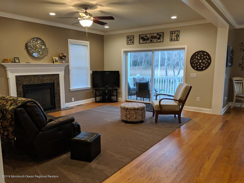 611 Riverside Drive Bayville, NJ 08721 - Photo 9 of 22 a living room with furniture and a fireplace