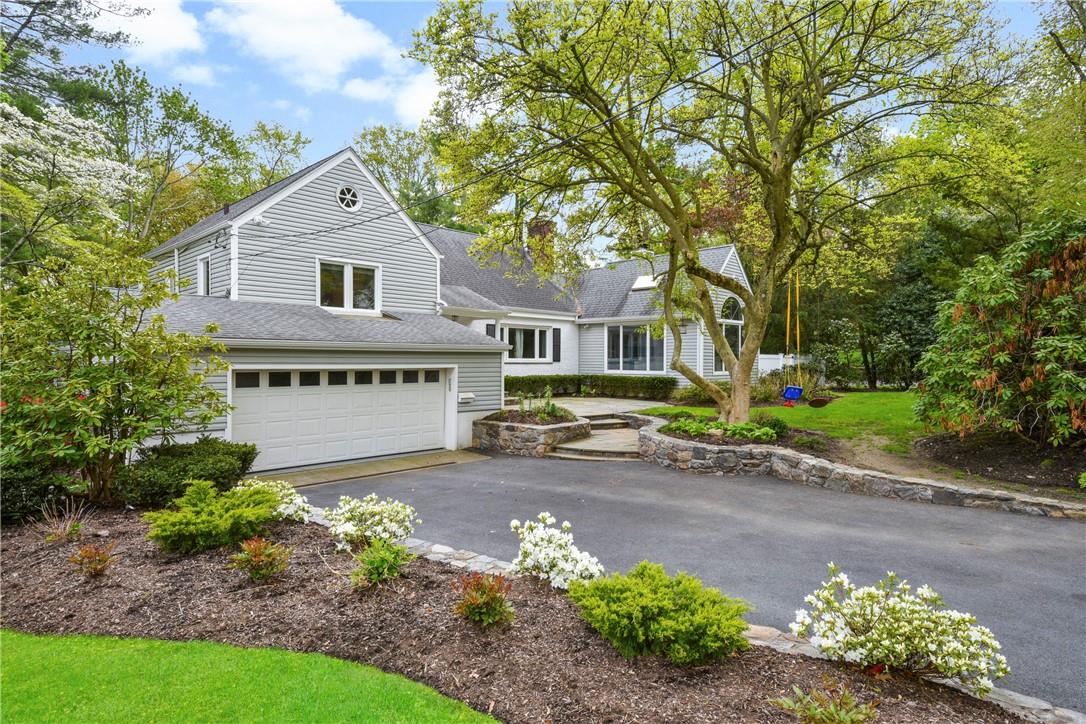 40 Hillandale Road Rye Brook, NY 10573 - Photo 1 of 1 a front view of a house with a yard and a garden