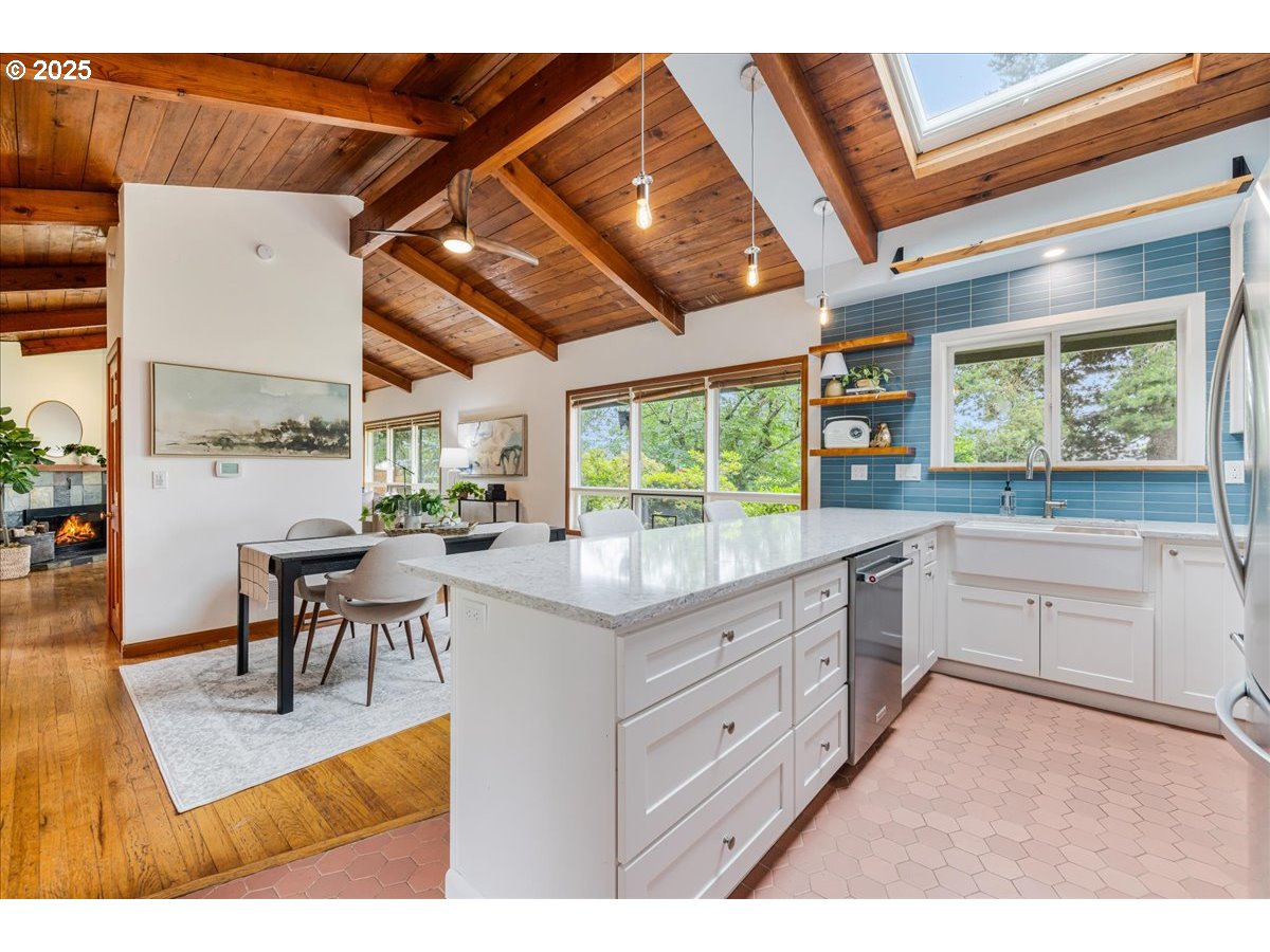 11805 Southwest Belvidere Place Portland, OR 97225 - Photo 12 of 44 a kitchen with granite countertop lots of counter top space