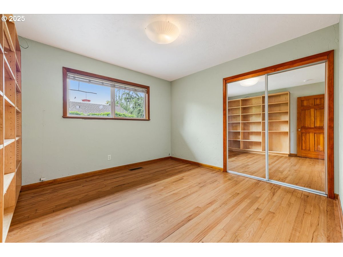 11805 Southwest Belvidere Place Portland, OR 97225 - Photo 23 of 44 a view of an empty room with a window