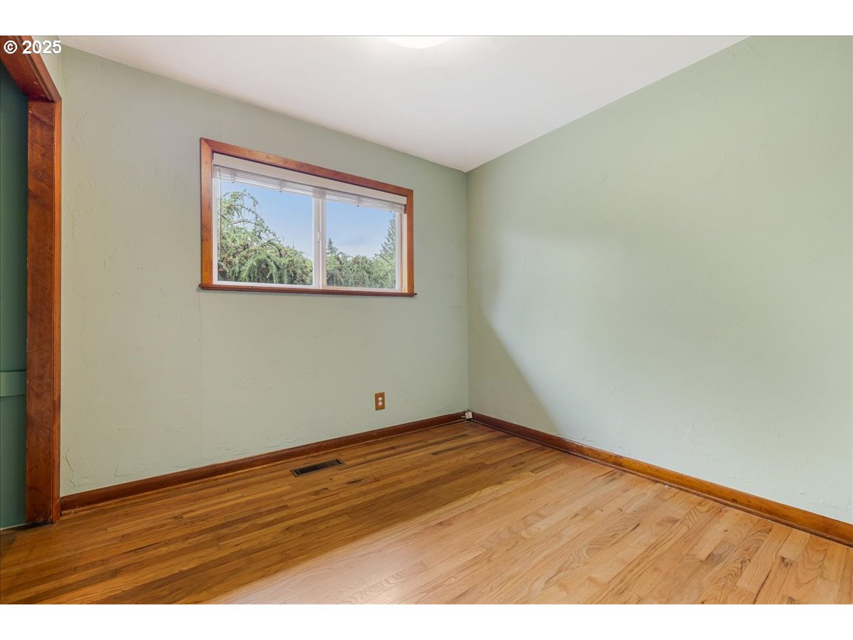11805 Southwest Belvidere Place Portland, OR 97225 - Photo 25 of 44 a view of an empty room with wooden floor