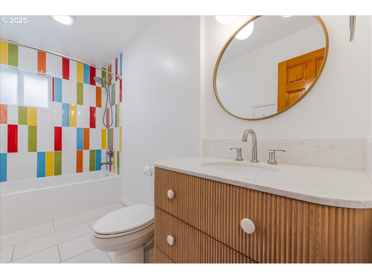 11805 Southwest Belvidere Place Portland, OR 97225 - Photo 27 of 44 a bathroom with a sink vanity mirror and toilet