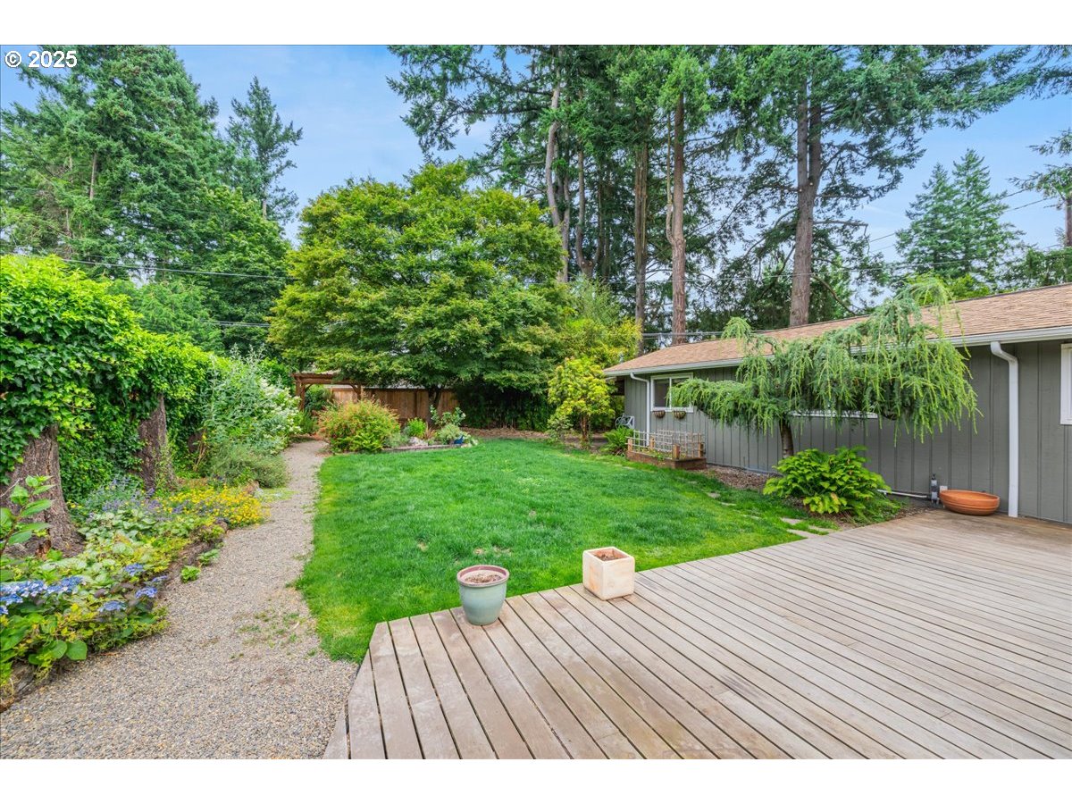 11805 Southwest Belvidere Place Portland, OR 97225 - Photo 29 of 44 a view of a wooden deck and garden