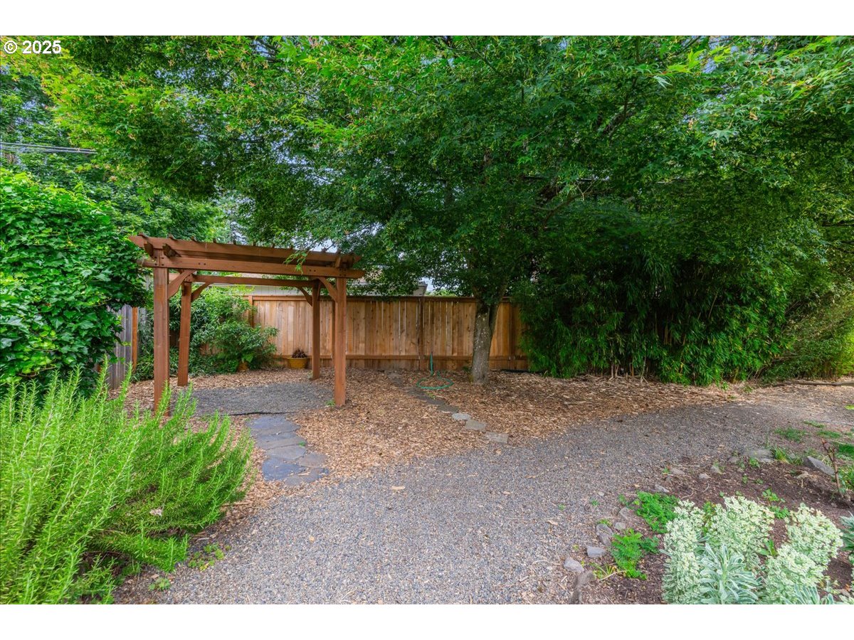 11805 Southwest Belvidere Place Portland, OR 97225 - Photo 34 of 44 a backyard of a house with a lots of green space