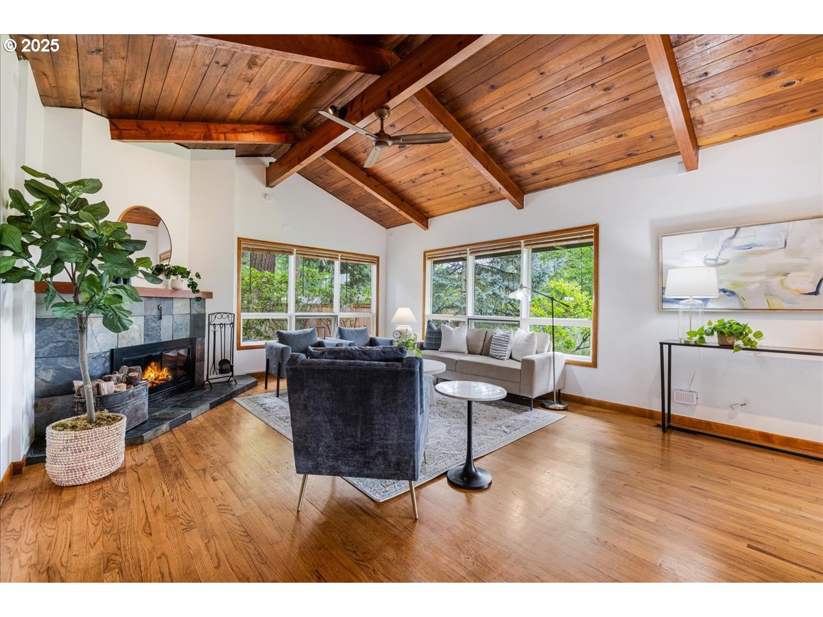11805 Southwest Belvidere Place Portland, OR 97225 - Photo 4 of 44 a living room with furniture and a large window