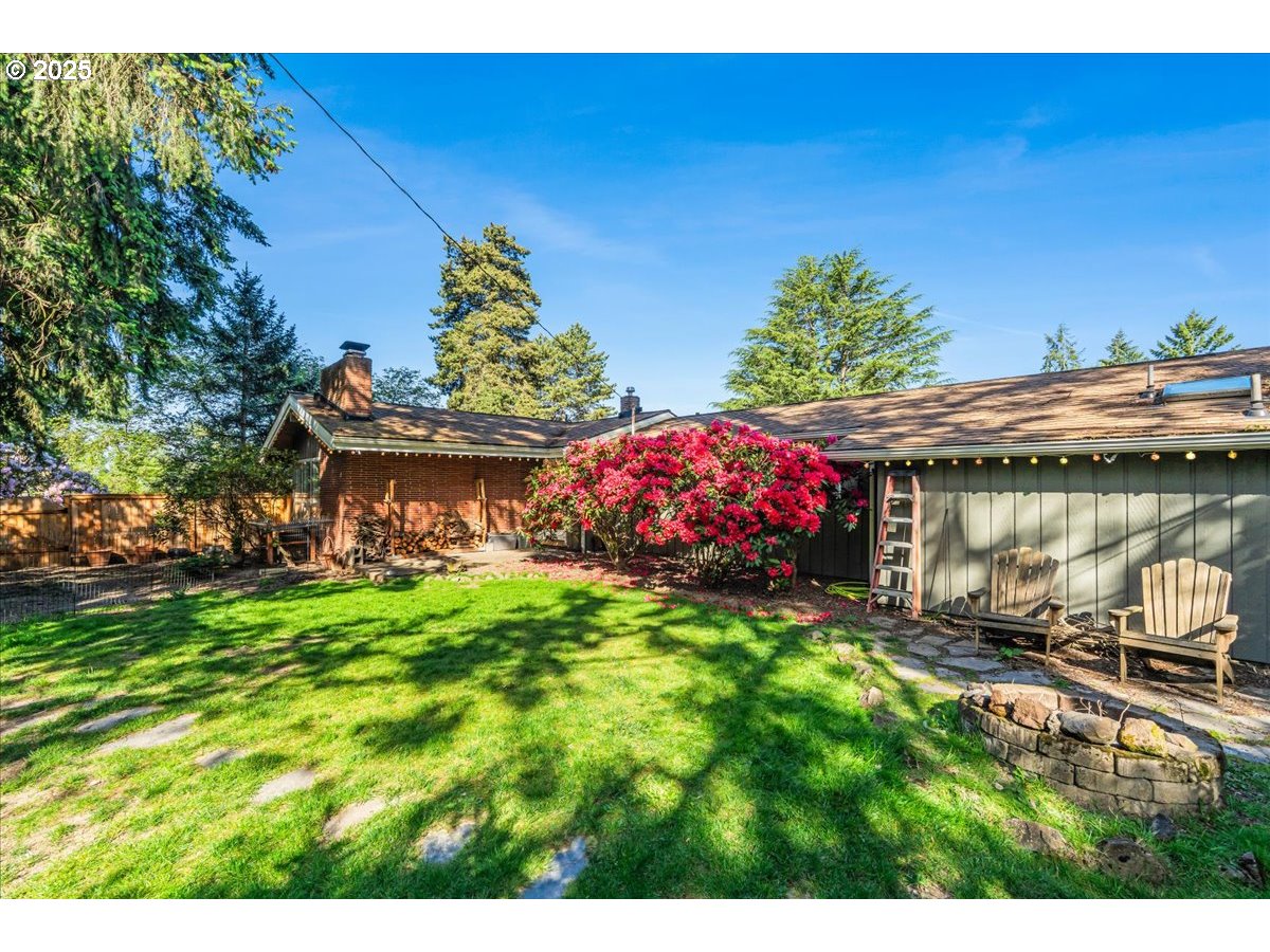 11805 Southwest Belvidere Place Portland, OR 97225 - Photo 41 of 44 a front view of a house with garden
