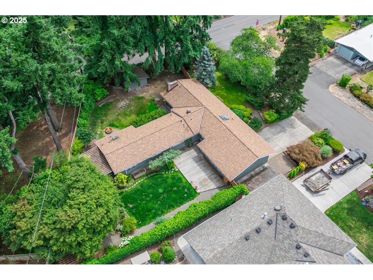 11805 Southwest Belvidere Place Portland, OR 97225 - Photo 43 of 44 an aerial view of a house with a yard and lake view
