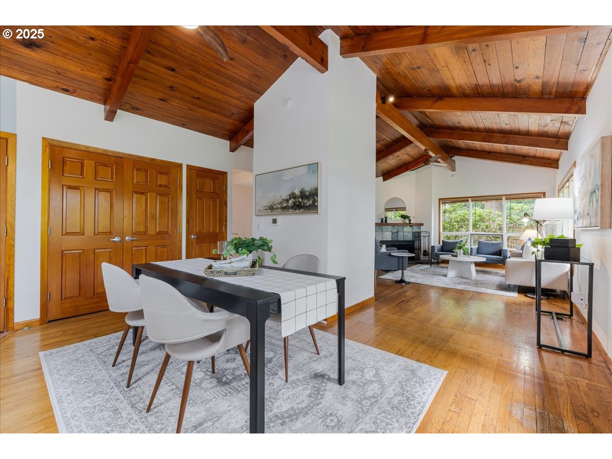 11805 Southwest Belvidere Place Portland, OR 97225 - Photo 8 of 44 a view of a dining room with furniture window and wooden floor
