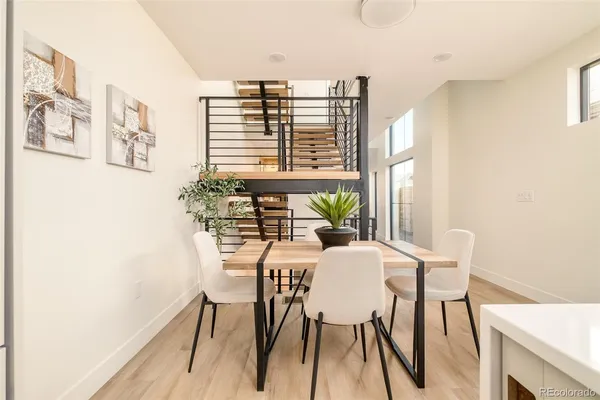 a view of a dining room with furniture and a window