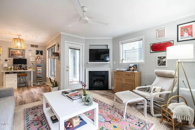 a living room with furniture fireplace and flat screen tv