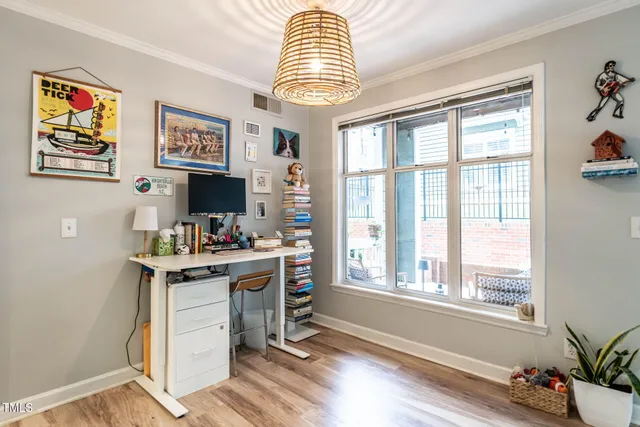 a workspace with furniture and a window