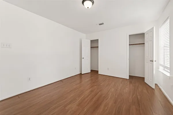 a bedroom with a bed furniture and a window
