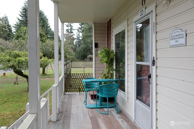 a balcony with furniture and garden view