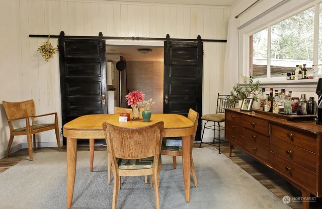 a view of a dining room with furniture window and outside view