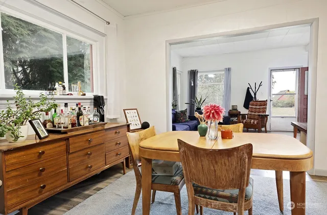 a view of a dining room with furniture window and outside view