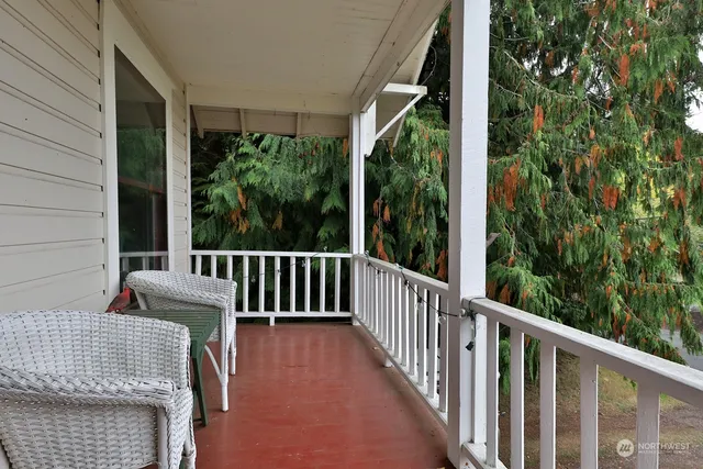 a view of a room with furniture and windows