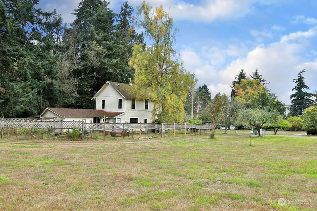 a swimming pool view with a outdoor seating