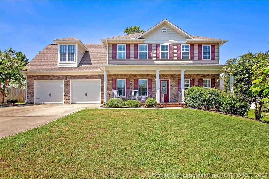 71 Germantown Road Cameron, NC 28326 - Photo 1 of 36 a front view of a house with garden