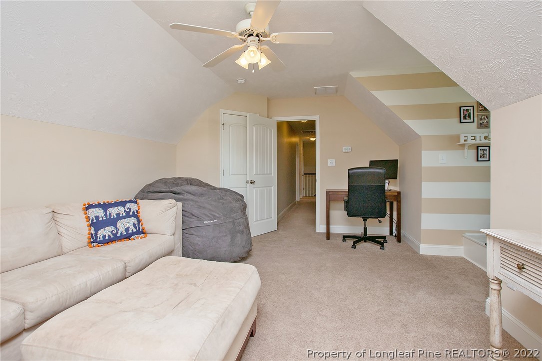 71 Germantown Road Cameron, NC 28326 - Photo 23 of 36 a living room with furniture and a ceiling fan