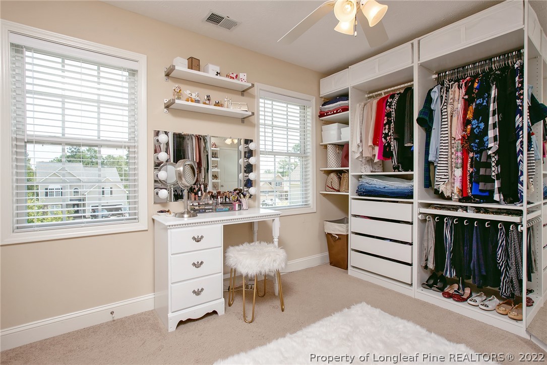 71 Germantown Road Cameron, NC 28326 - Photo 26 of 36 a view of walk in closet with clothes and shoes
