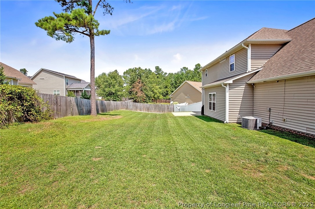 71 Germantown Road Cameron, NC 28326 - Photo 3 of 36 a house view with a garden space