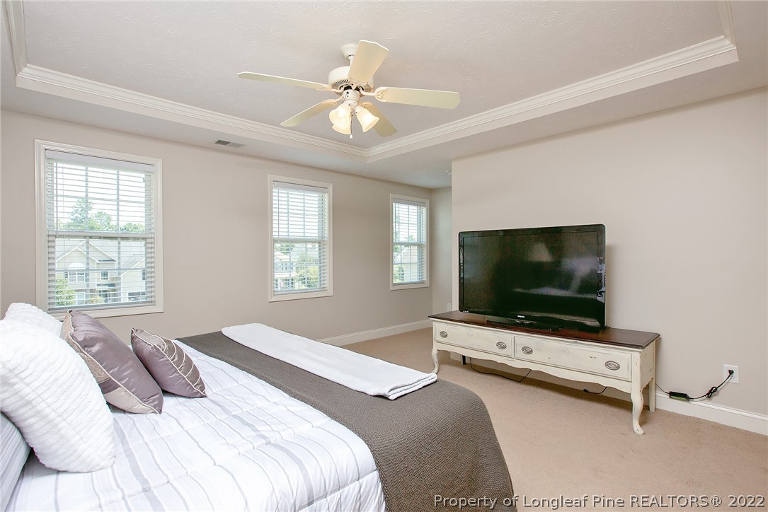 71 Germantown Road Cameron, NC 28326 - Photo 33 of 36 a bedroom with a bed and a flat screen tv
