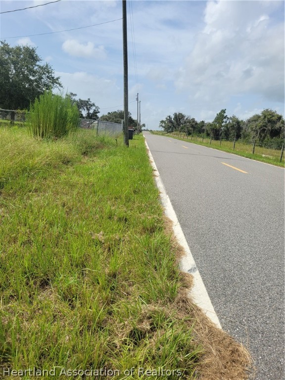 1430 Old Stokes Road Frostproof, FL 33843 - Photo 3 of 3 a view of a lake with a big yard