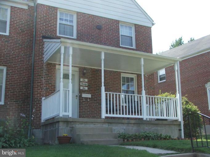 622 Braeside Road Baltimore, MD 21229 - Photo 1 of 17 a front view of a house with a yard