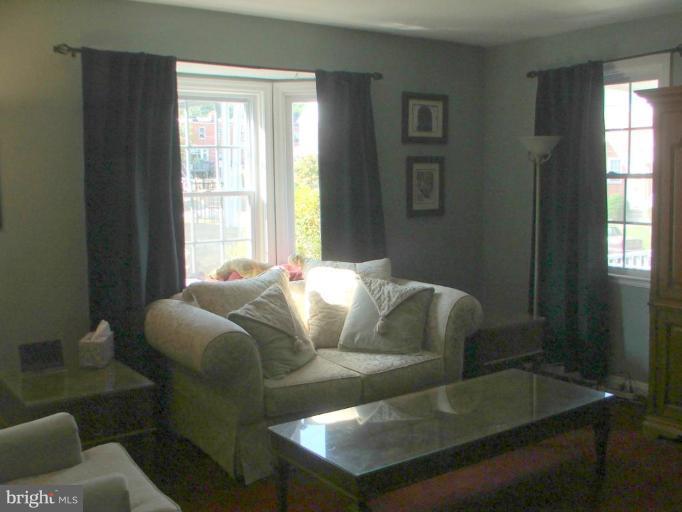 622 Braeside Road Baltimore, MD 21229 - Photo 5 of 17 a living room with furniture and a window