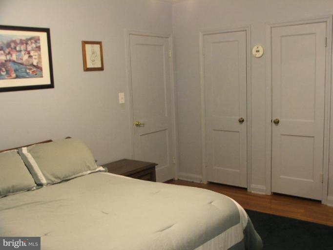 622 Braeside Road Baltimore, MD 21229 - Photo 9 of 17 a bedroom with a bed and wall painting
