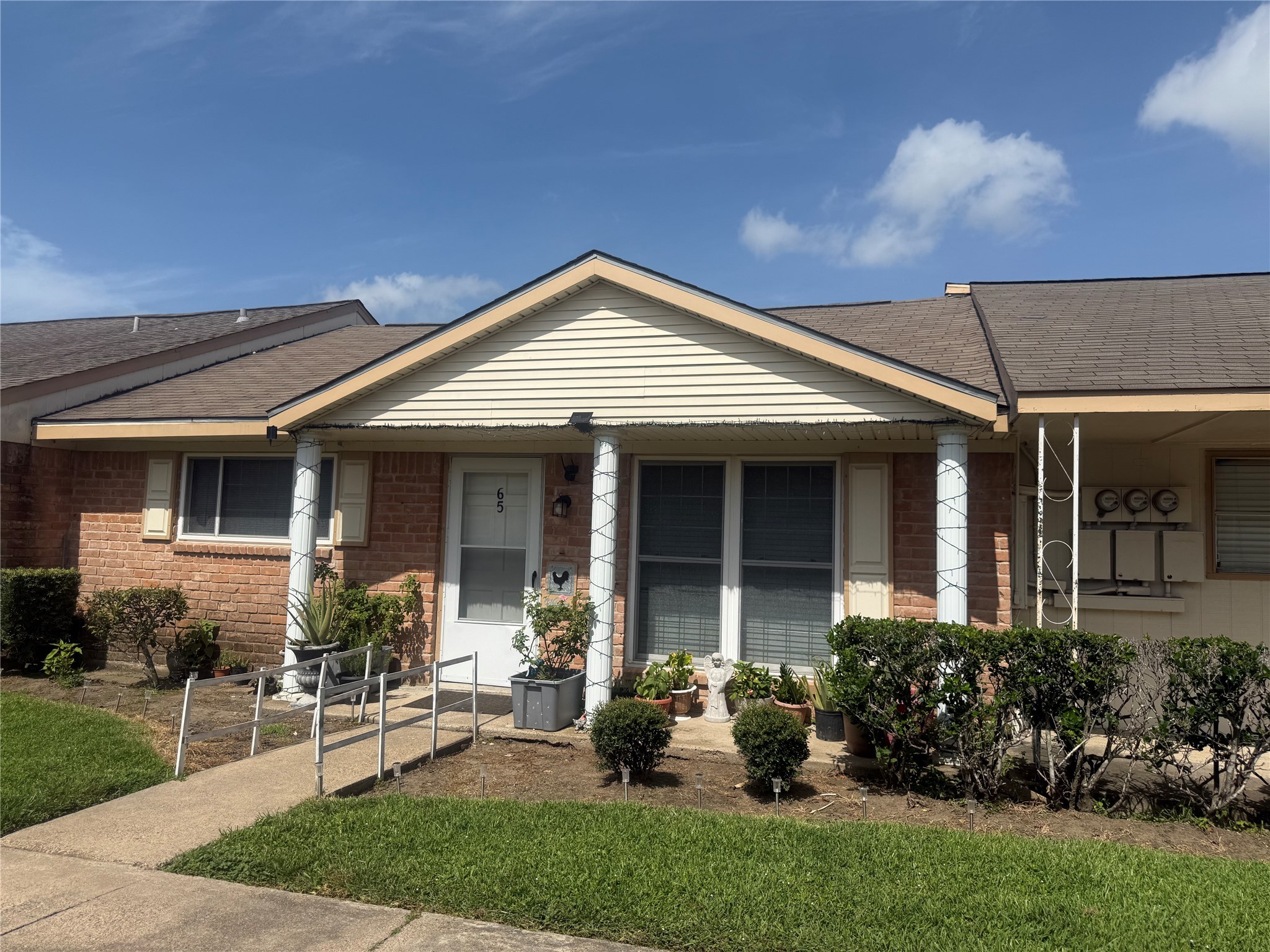 0 Burke Road Pasadena, TX 77504 - Photo 11 of 18 a front view of a house with a garden and plants