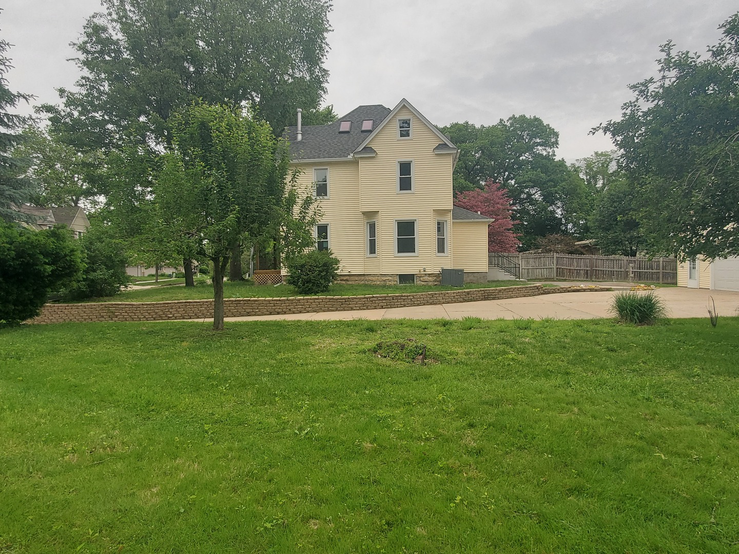 712 3rd Street Moline, IL 61265 - Photo 3 of 29 a front view of a house with a yard