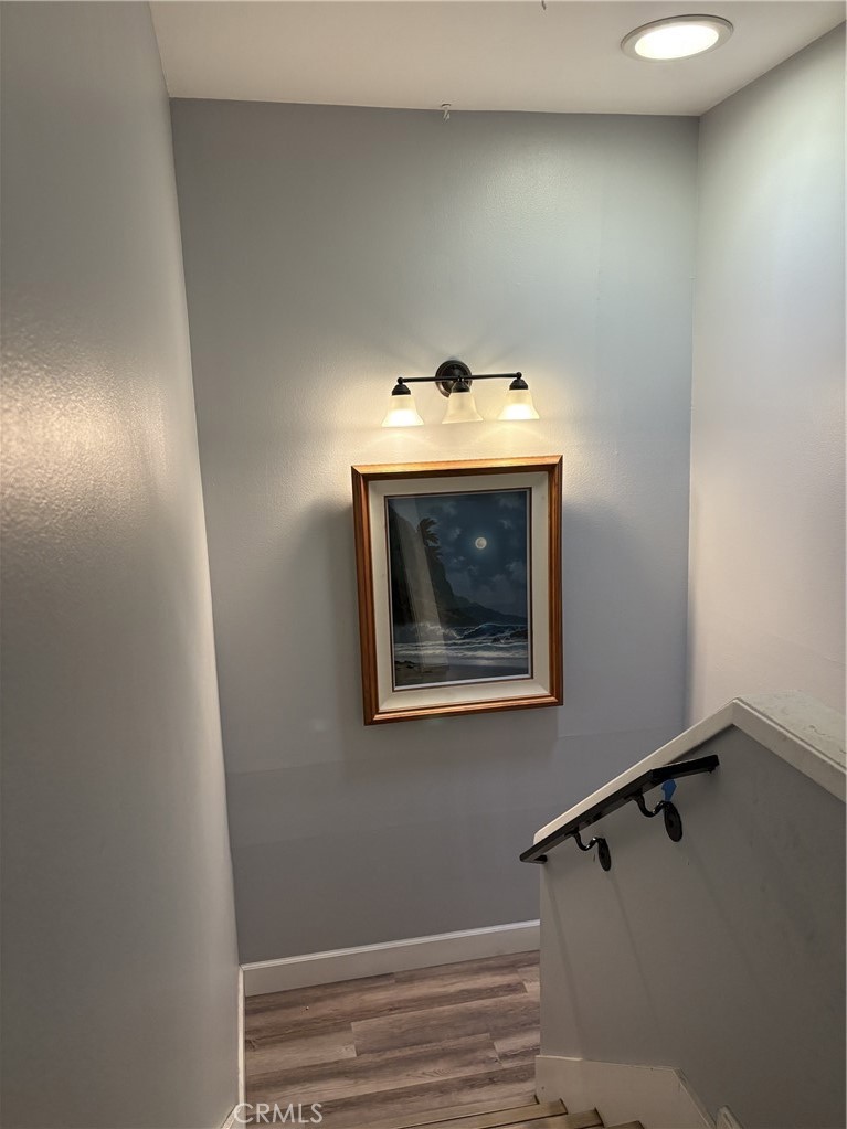 4731 Rey Drive, Unit 133 Huntington Beach, CA 92649 - Photo 14 of 31 a view of a hallway with washer and dryer