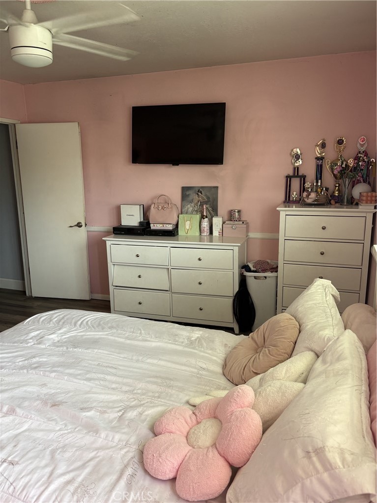 4731 Rey Drive, Unit 133 Huntington Beach, CA 92649 - Photo 16 of 31 a bedroom with a bed and flat screen tv