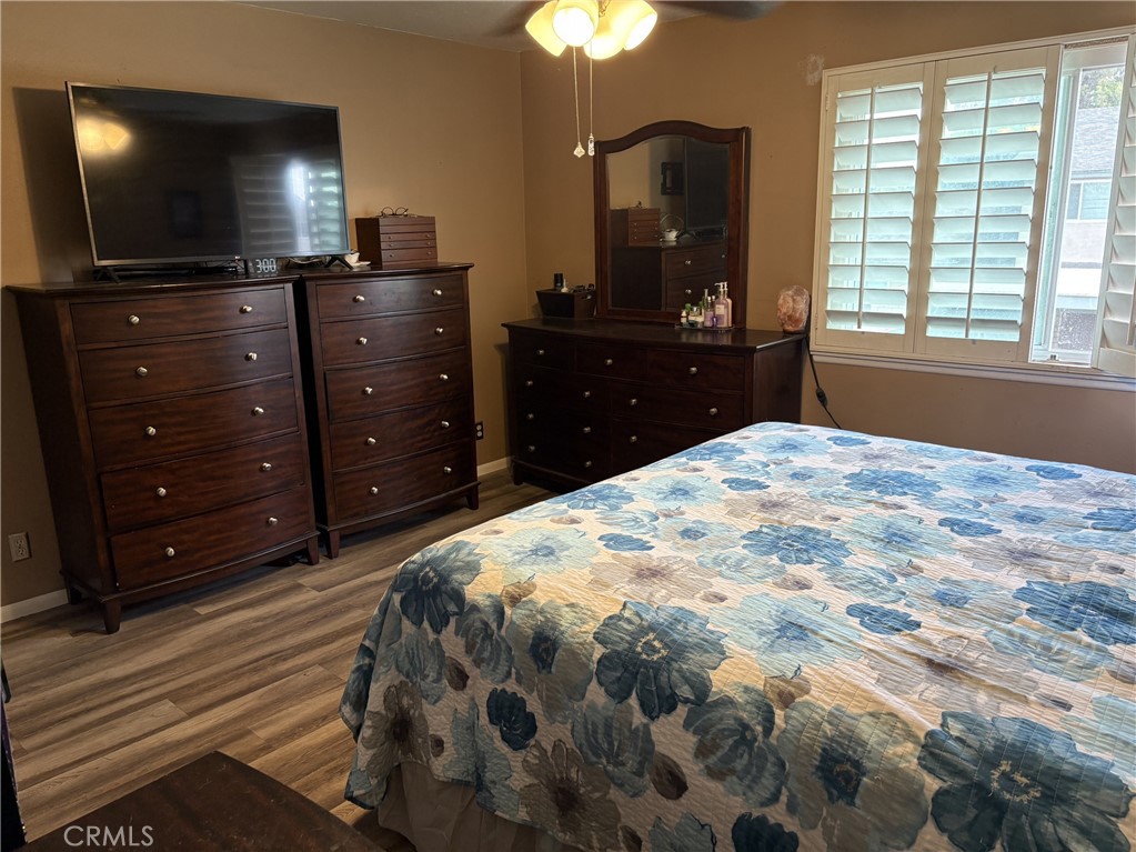 4731 Rey Drive, Unit 133 Huntington Beach, CA 92649 - Photo 20 of 31 a bedroom with a bed and a flat screen tv