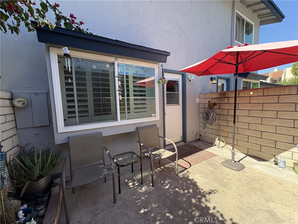 4731 Rey Drive, Unit 133 Huntington Beach, CA 92649 - Photo 23 of 31 a front view of a house with patio