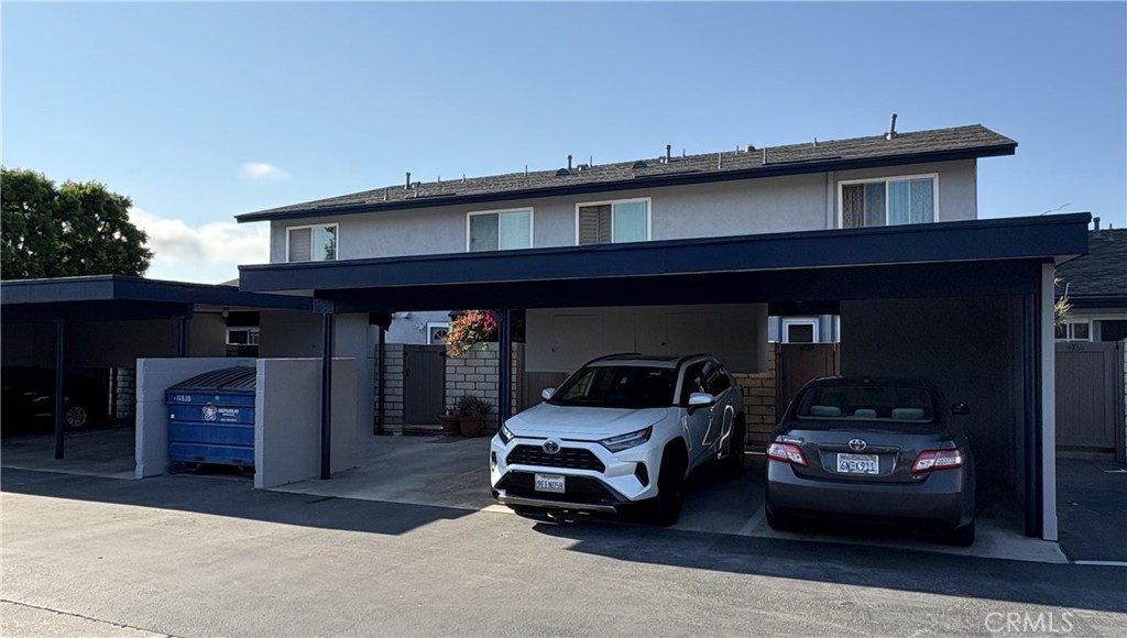 4731 Rey Drive, Unit 133 Huntington Beach, CA 92649 - Photo 28 of 31 a car parked in front of a building