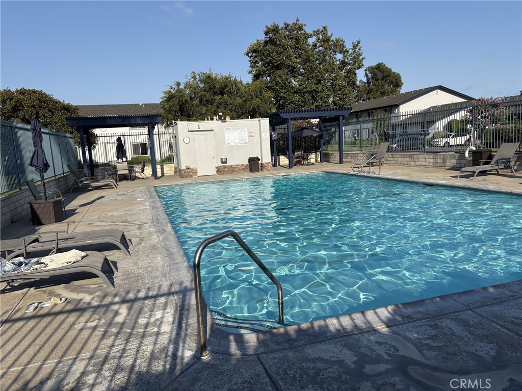 4731 Rey Drive, Unit 133 Huntington Beach, CA 92649 - Photo 29 of 31 a view of a swimming pool with a patio