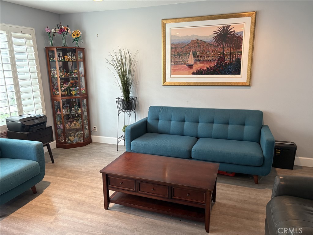 4731 Rey Drive, Unit 133 Huntington Beach, CA 92649 - Photo 5 of 31 a living room with furniture and a window