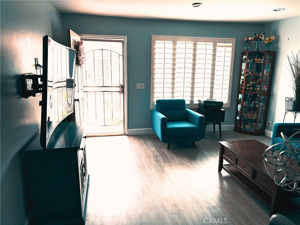 4731 Rey Drive, Unit 133 Huntington Beach, CA 92649 - Photo 6 of 31 a living room with furniture and a large window