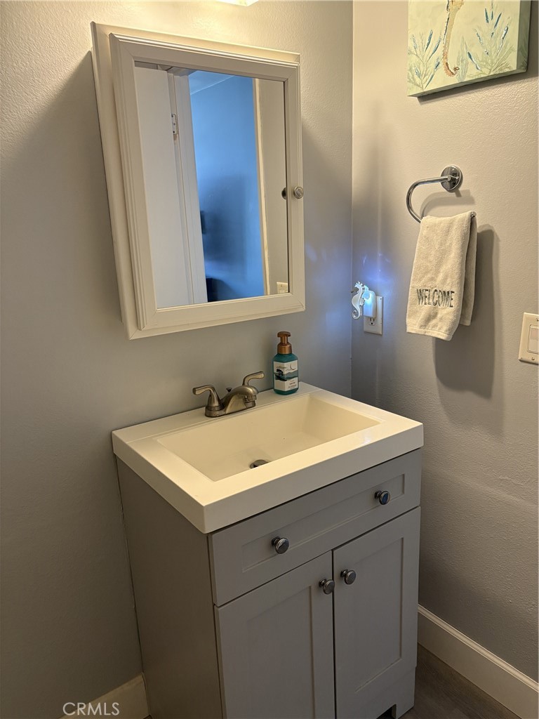 4731 Rey Drive, Unit 133 Huntington Beach, CA 92649 - Photo 9 of 31 a bathroom with a sink and a mirror