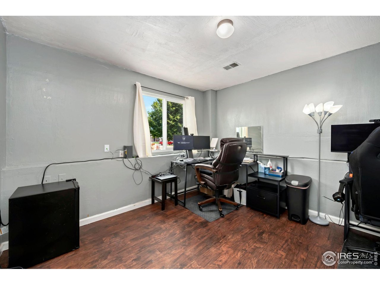 1113 East 24th Street Road Greeley, CO 80631 - Photo 14 of 25 a workspace with furniture and a window